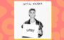 Justin Bieber segurando plaquinha que diz "sorry"