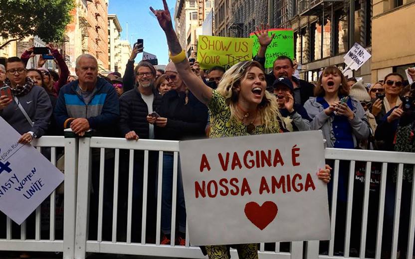 Miley Cyrus em montagem onde segura um cartaz que diz "a vagina é nossa amiga"