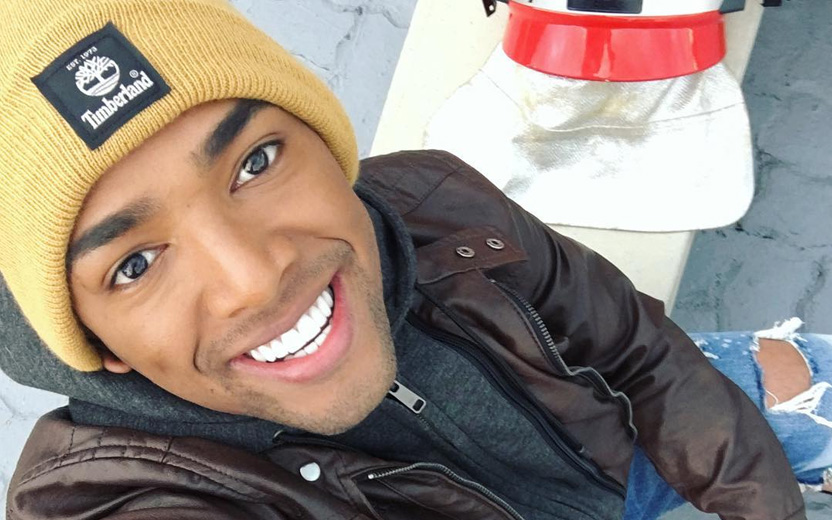 nego do borel sorrindo usando touca amarela
