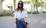 Look com saia jeans e blusa de ombro a ombro
